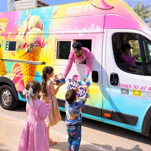 Students enjoying soft serve ice cream truck